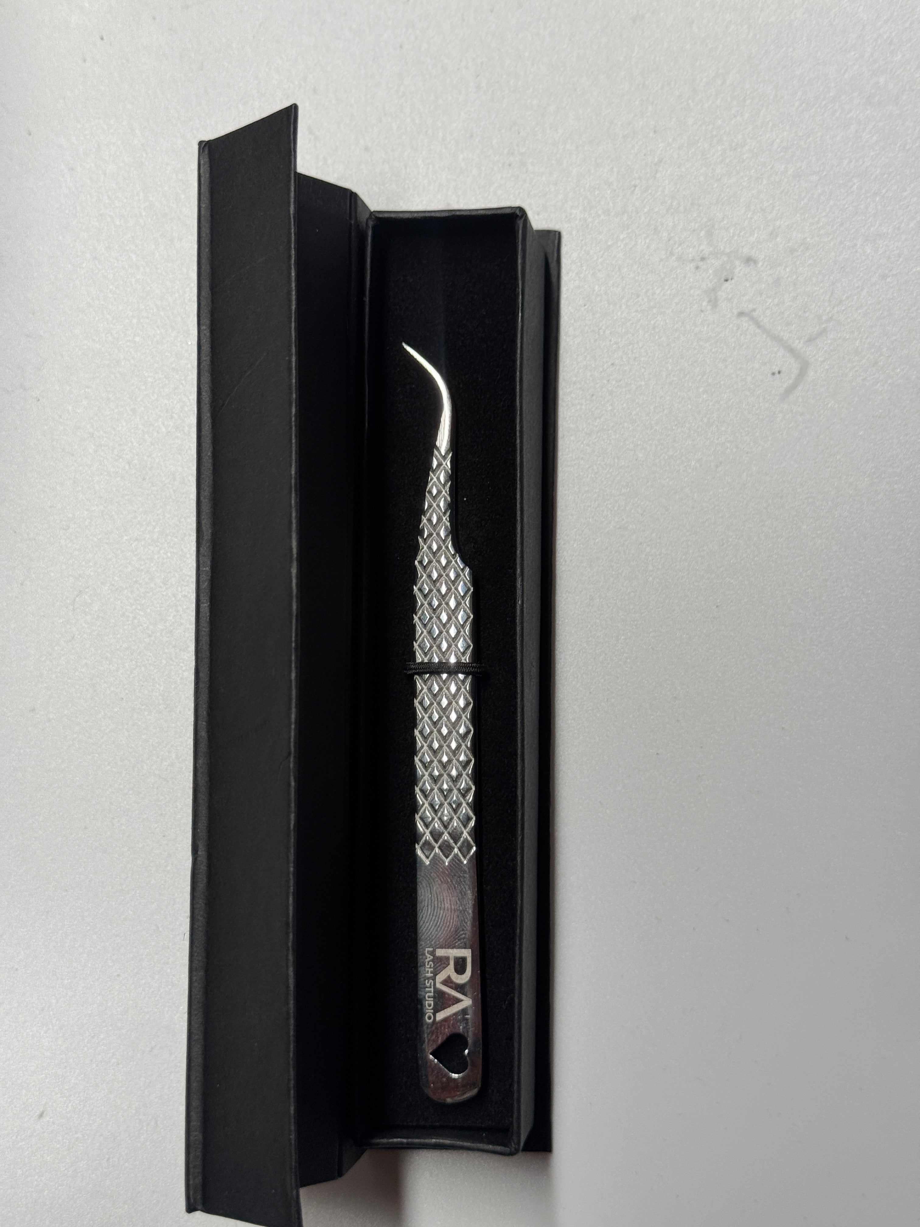 Curved isolation tweezer